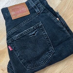 Levi’s Premium 501 Mid Thigh Shorts - Black Distressed. Size 23.